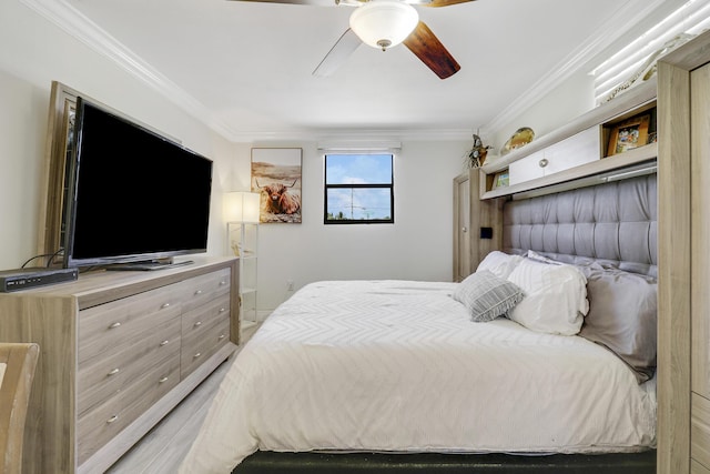 bedroom with ceiling fan and ornamental molding