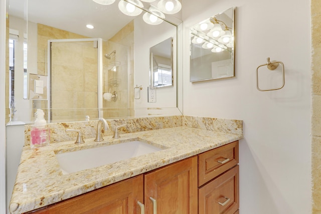 bathroom with vanity and walk in shower