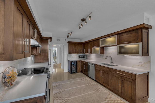 kitchen with tasteful backsplash, wine cooler, sink, electric stove, and stainless steel dishwasher