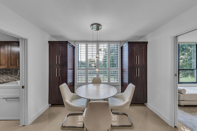 dining area with light tile patterned floors