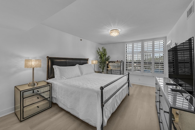 bedroom with light wood-type flooring