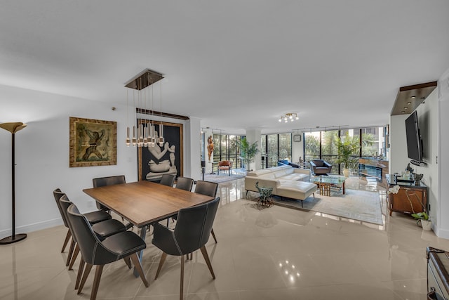 dining room with a wall of windows and light tile patterned flooring