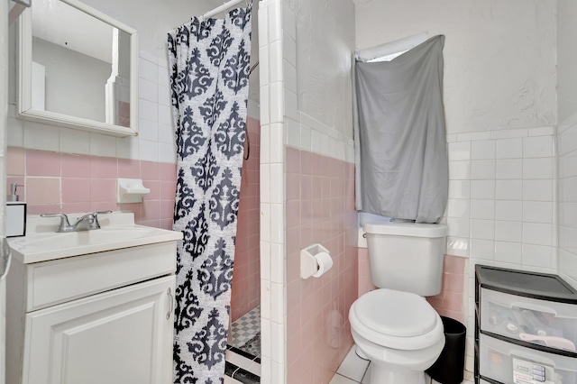 bathroom featuring a shower with curtain, vanity, tile walls, and toilet