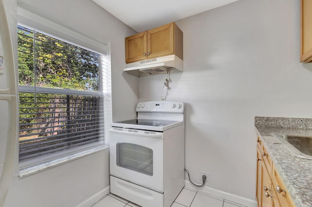 kitchen with electric range, light tile patterned flooring, and light stone countertops