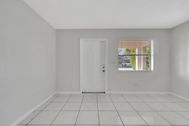 unfurnished room featuring light tile patterned floors