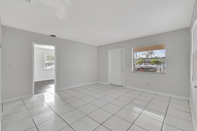 spare room with light tile patterned floors