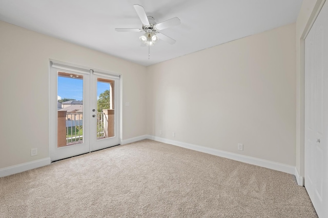 unfurnished room featuring ceiling fan and carpet flooring