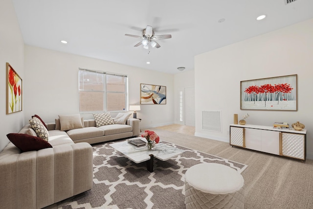 carpeted living room featuring ceiling fan