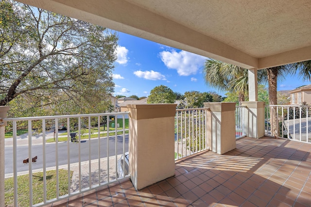 view of patio featuring a balcony