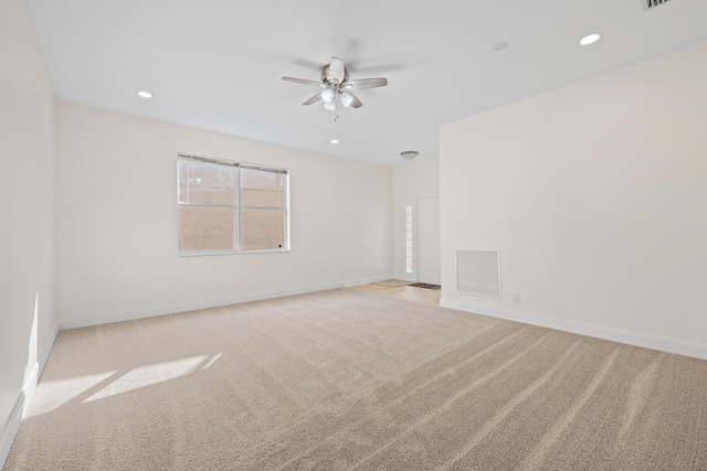 empty room with light carpet and ceiling fan