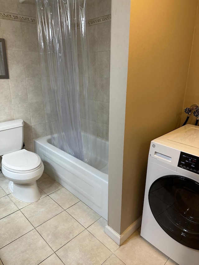 bathroom with tile patterned flooring, toilet, tile walls, shower / tub combo with curtain, and washer / dryer