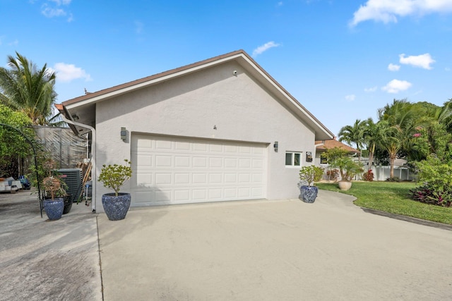 view of side of home featuring a garage