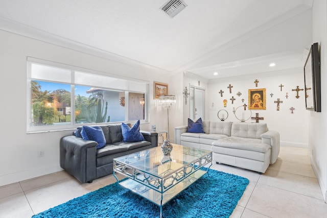 living room with vaulted ceiling and tile patterned flooring