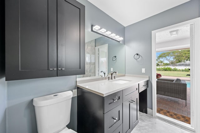 bathroom featuring toilet and vanity