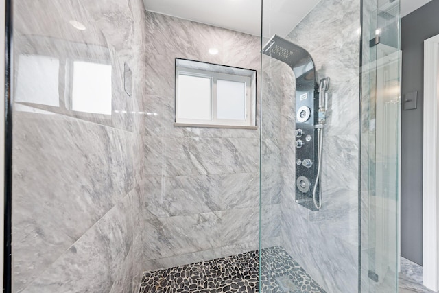 bathroom featuring tiled shower