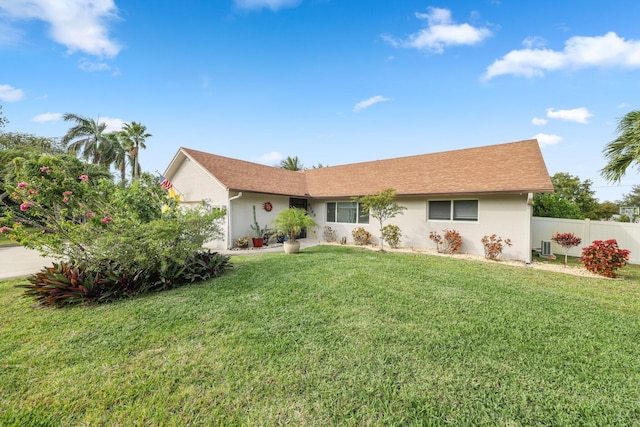 ranch-style home with a front yard