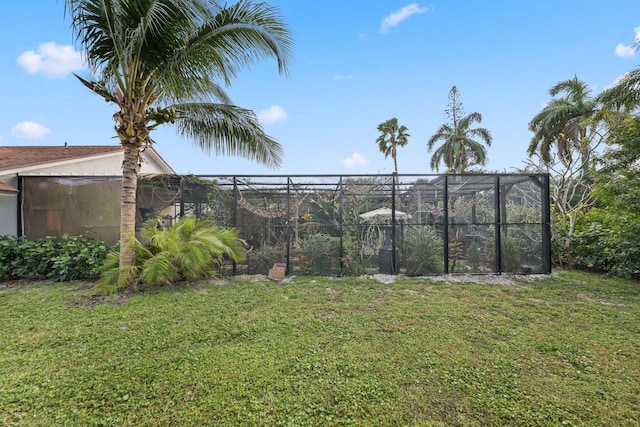 view of yard with glass enclosure