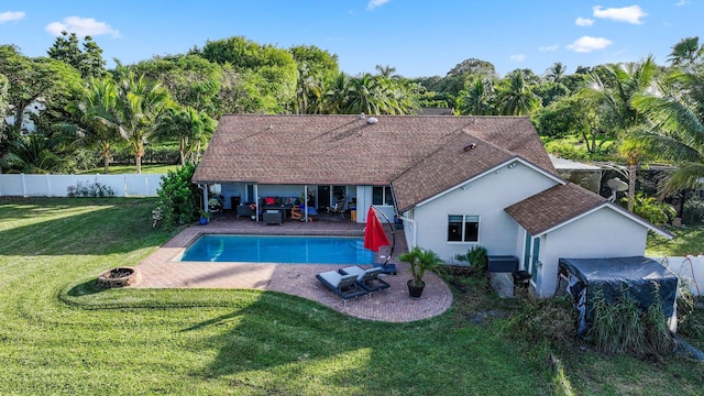 view of swimming pool featuring a yard and a patio