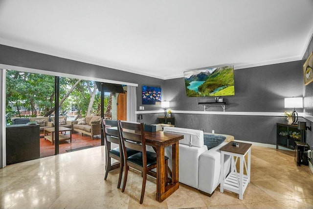 dining space featuring ornamental molding