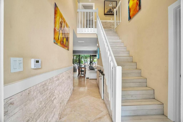 stairway featuring tile patterned flooring