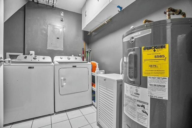 laundry area with water heater, light tile patterned flooring, washing machine and dryer, cabinets, and electric panel