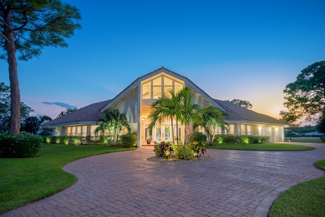 view of front of property with a lawn