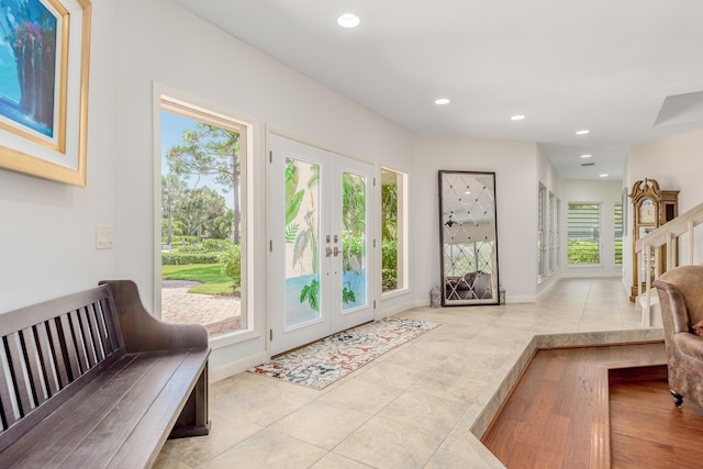 doorway with light tile patterned flooring and french doors