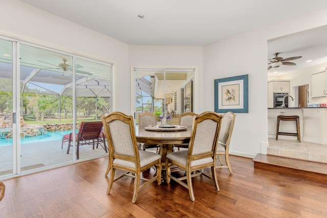 dining space with light hardwood / wood-style floors