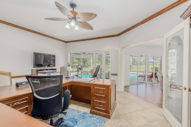 office area with ceiling fan, light tile patterned flooring, and crown molding