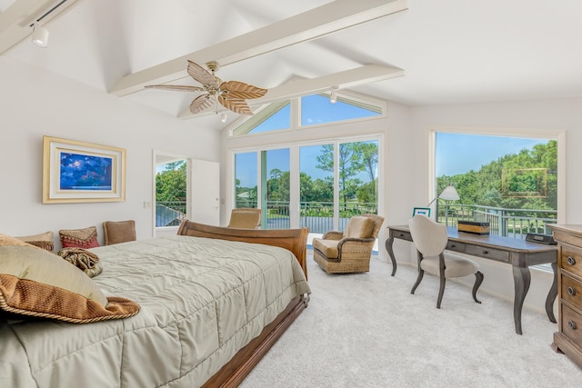 carpeted bedroom with vaulted ceiling with beams and ceiling fan