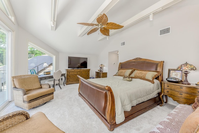 bedroom featuring lofted ceiling with beams, ceiling fan, light carpet, and track lighting