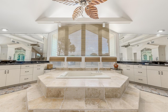 bathroom featuring beam ceiling, vanity, and plenty of natural light