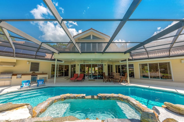 view of swimming pool with a lanai, area for grilling, and ceiling fan