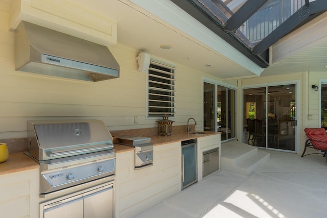 view of patio with area for grilling and sink