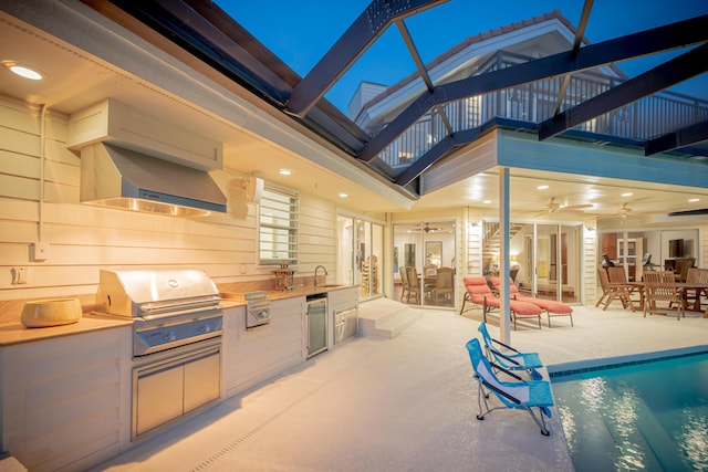 view of patio / terrace featuring sink, a grill, ceiling fan, a balcony, and area for grilling