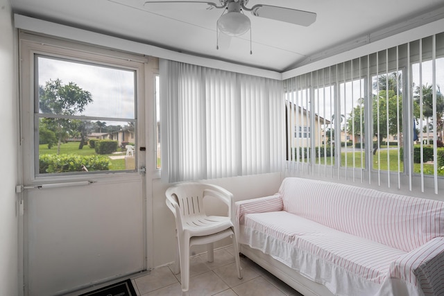 sunroom featuring ceiling fan