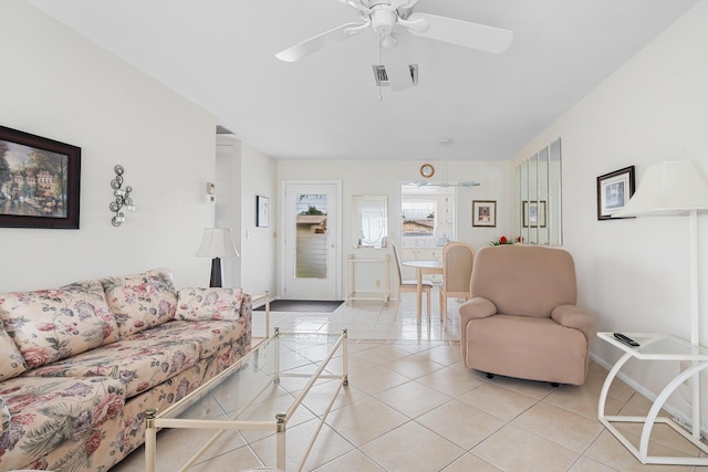 living room featuring ceiling fan and light tile patterned floors