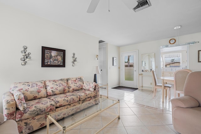 living room featuring ceiling fan and light tile patterned floors