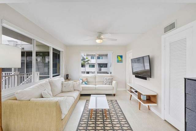 living room featuring ceiling fan