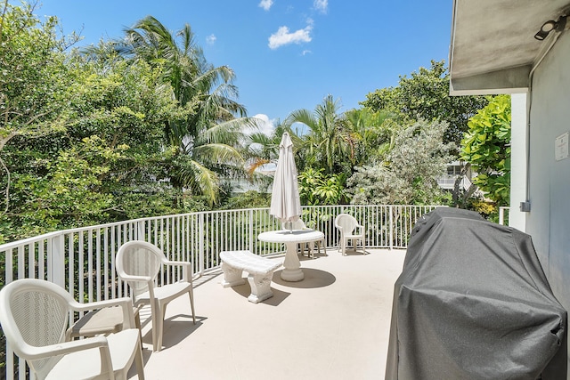 view of patio / terrace featuring area for grilling and a balcony