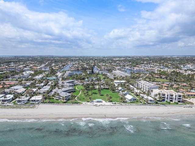 drone / aerial view featuring a view of the beach and a water view