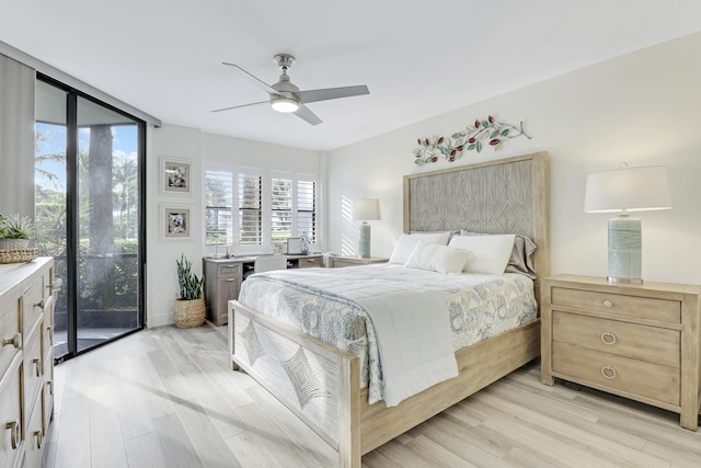 bedroom featuring access to outside, ceiling fan, and light hardwood / wood-style flooring