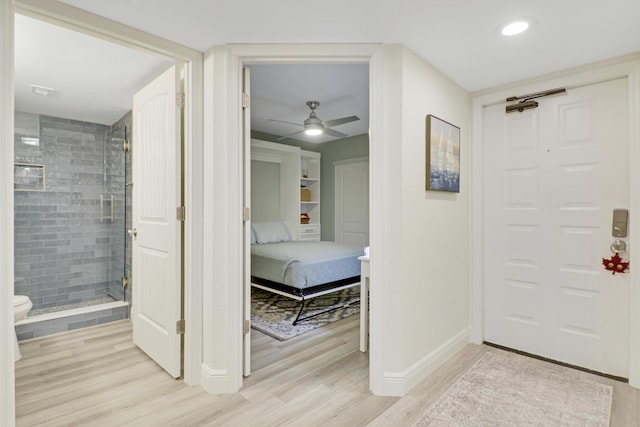 entryway featuring ceiling fan and light hardwood / wood-style flooring