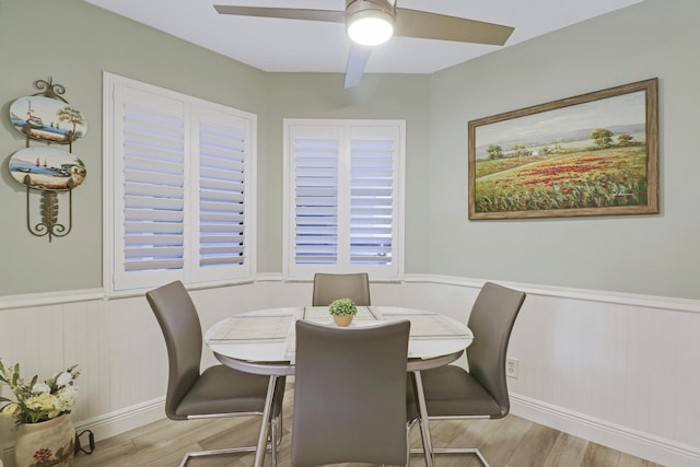 dining space featuring ceiling fan and light hardwood / wood-style floors