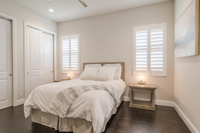 bedroom with ceiling fan, a closet, and dark hardwood / wood-style floors