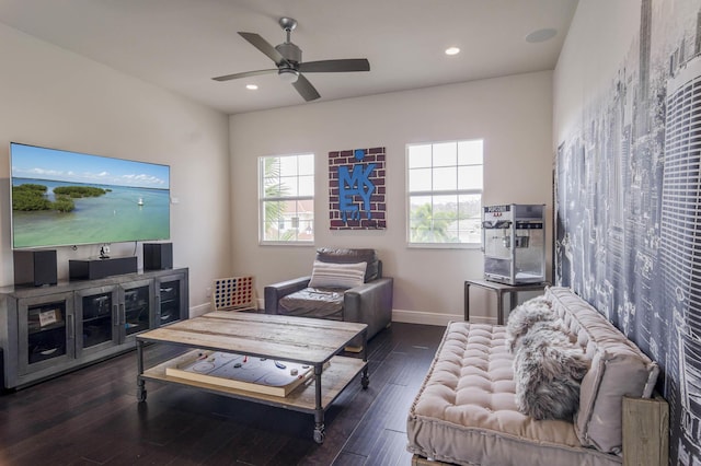 living room featuring ceiling fan and dark hardwood / wood-style flooring