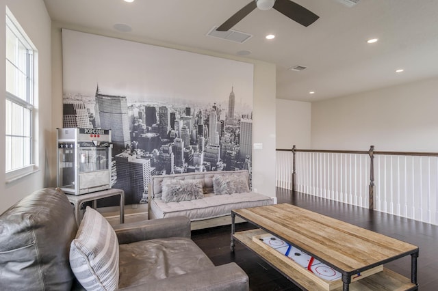 living room with ceiling fan and dark hardwood / wood-style floors