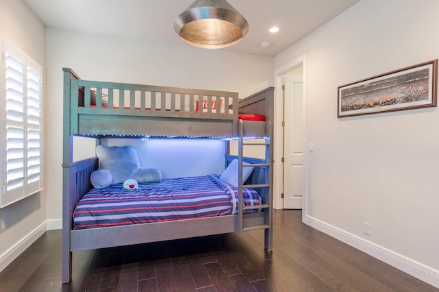 bedroom with hardwood / wood-style flooring