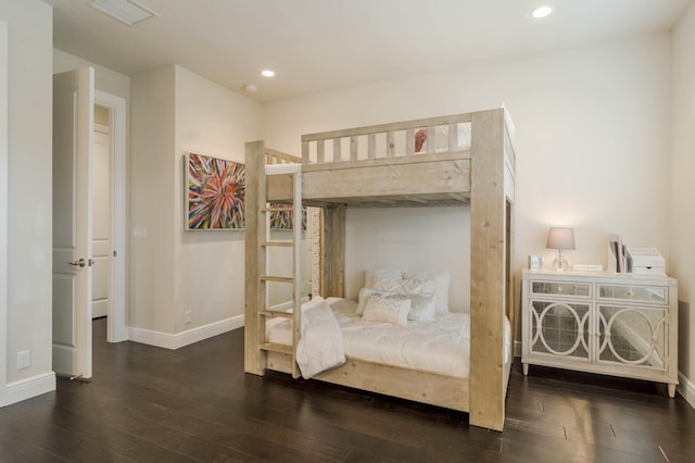 bedroom featuring dark hardwood / wood-style flooring