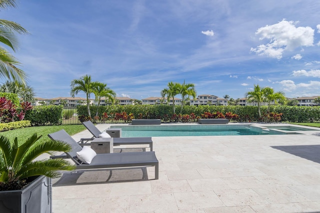 view of swimming pool featuring a patio